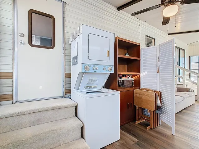 a view of backyard with a tub and trees