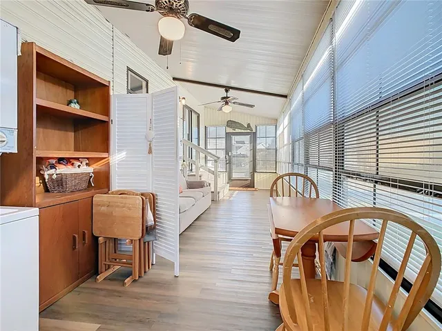an aerial view of a houses with a swimming pool