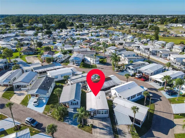 an aerial view of a house with a lake view