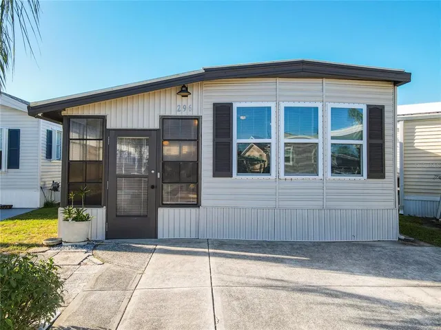 a view of a dining room with furniture and a chandelier
