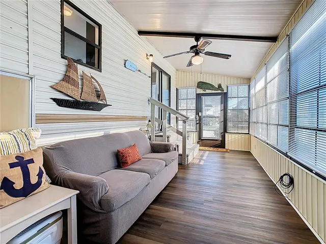 a large kitchen with a table and chairs