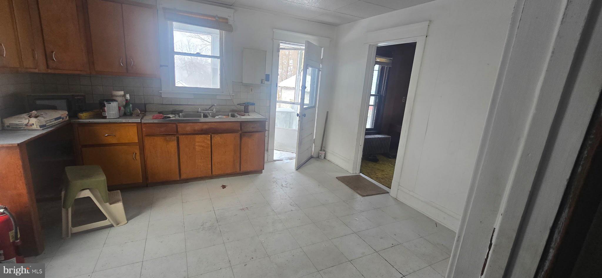 18064 Cussewago Road Meadville, PA 16335 - Photo 8 of 14 a room with granite countertop cabinets and sink