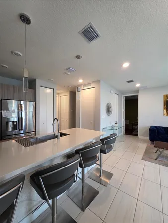 a bathroom with a sink a mirror and a shower