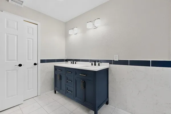 a bathroom with a bathtub and shower