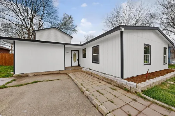 a house with trees in front of it