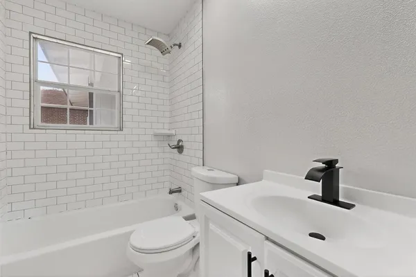 a bathroom with a sink and a toilet