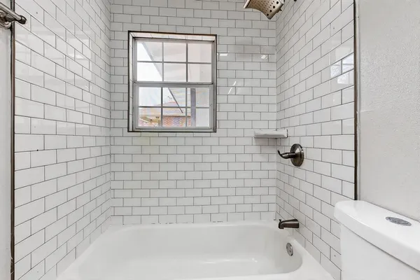 a view of room with wooden floor and window