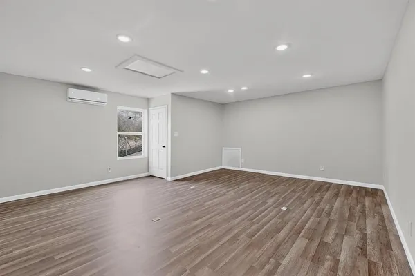 a view of a backyard with wooden fence