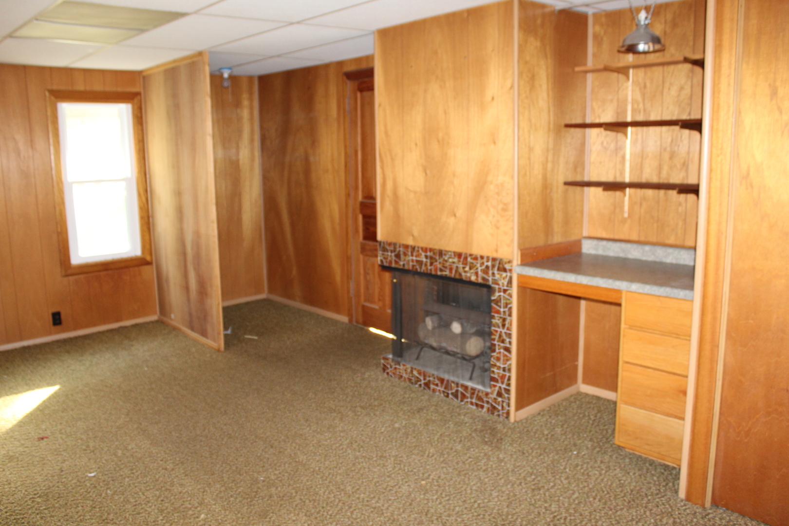 9729 Beaver Valley Road Belvidere, IL 61008 - Photo 39 of 39 a view of an empty room with a fireplace and a window
