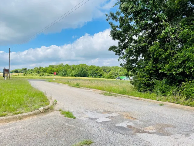 a view of a lake with a big yard