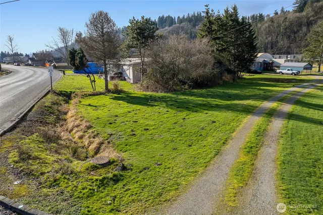 a view of a backyard with swimming pool