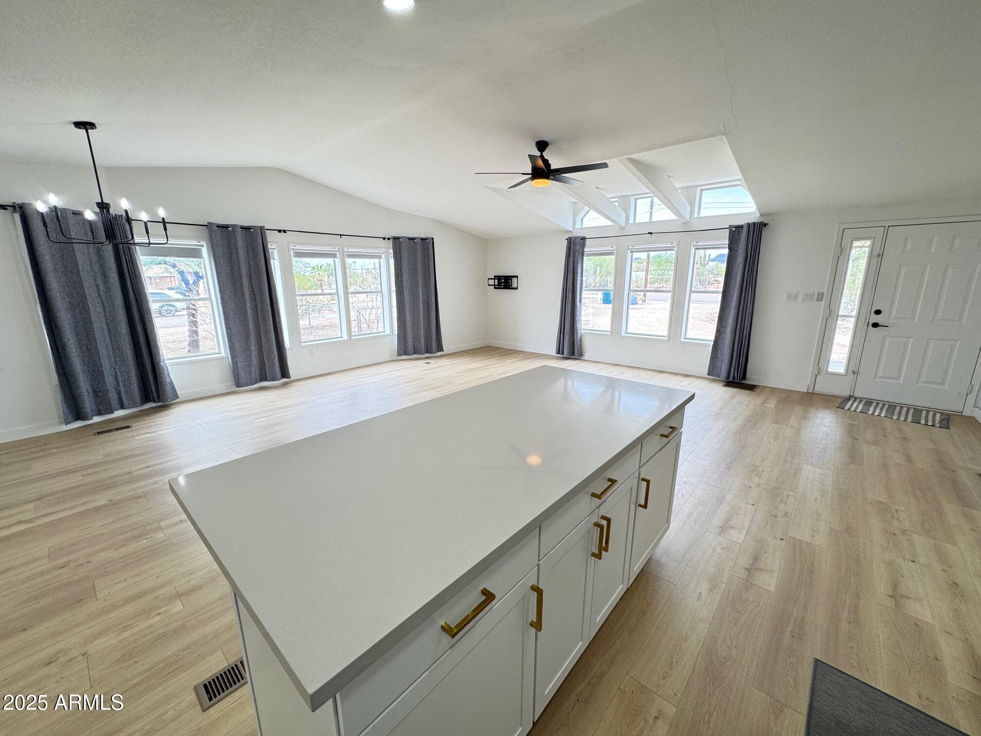 1835 East 20th Avenue Apache Junction, AZ 85119 - Photo 12 of 29 a large room with wooden floor and windows