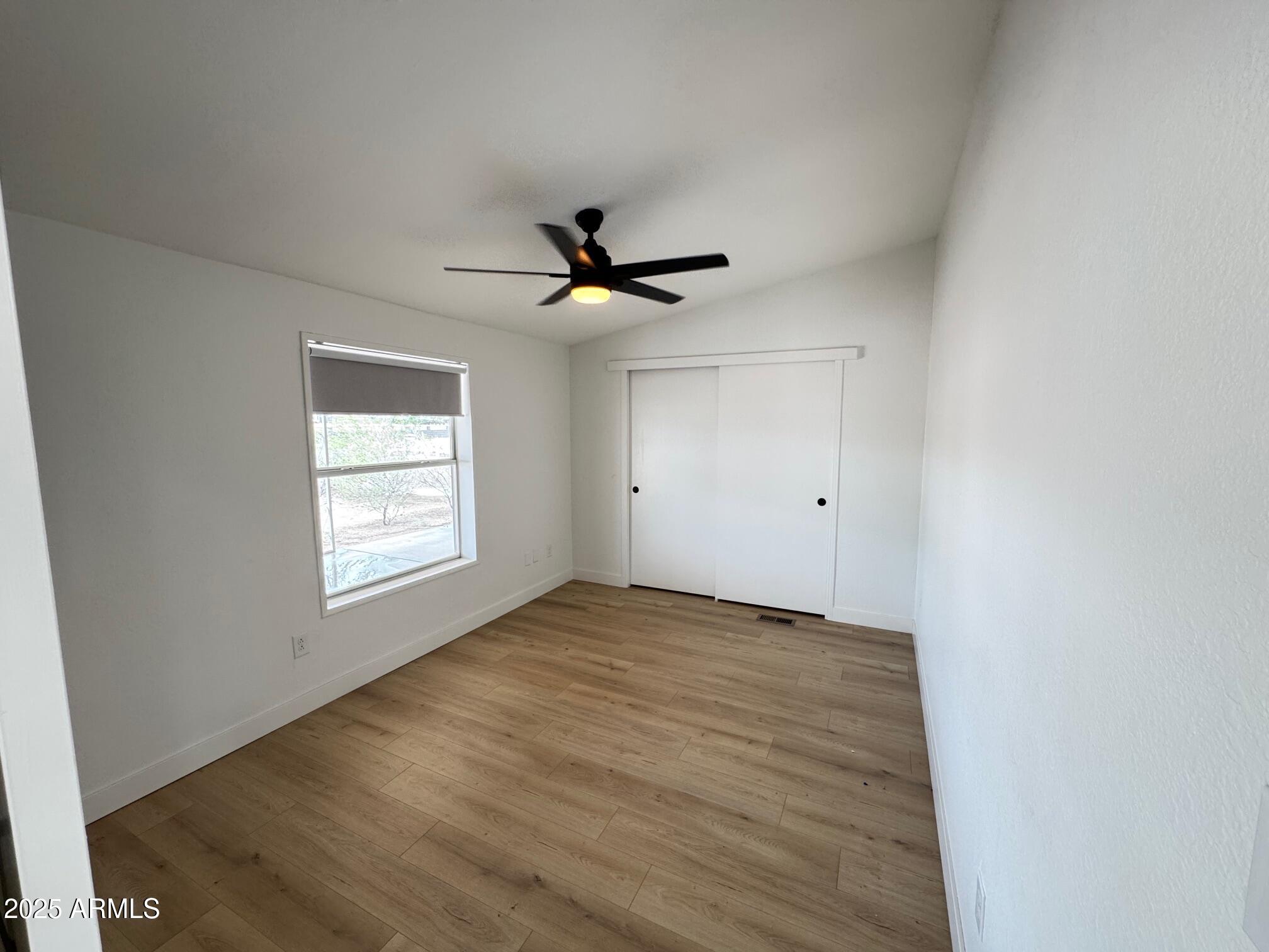 1835 East 20th Avenue Apache Junction, AZ 85119 - Photo 14 of 29 a view of an empty room with a window