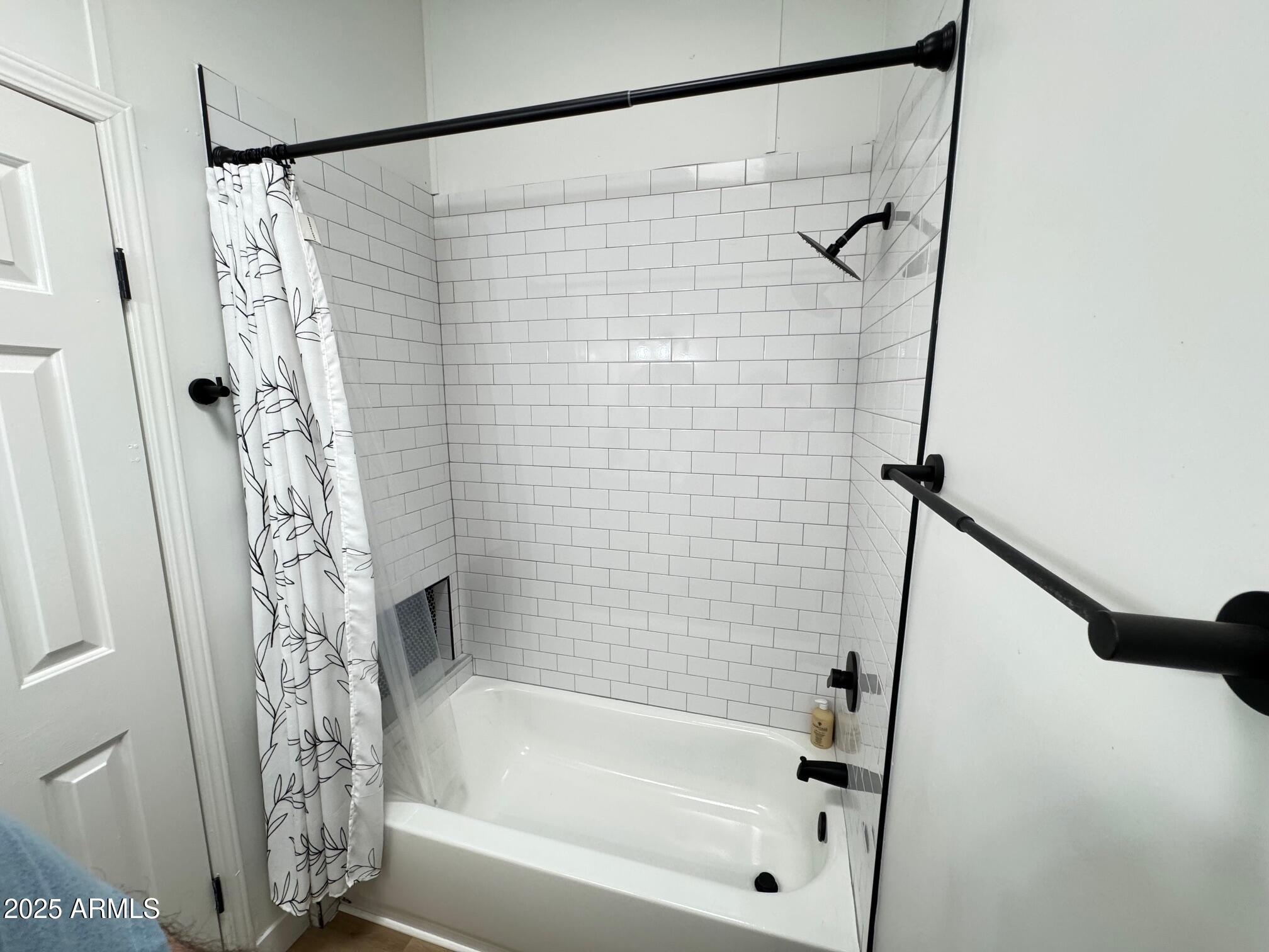 1835 East 20th Avenue Apache Junction, AZ 85119 - Photo 16 of 29 a bathroom with a shower and a bath tub