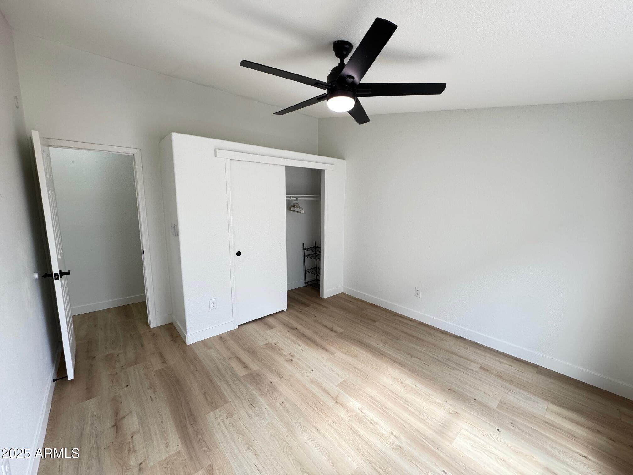 1835 East 20th Avenue Apache Junction, AZ 85119 - Photo 17 of 29 wooden floor in an empty room