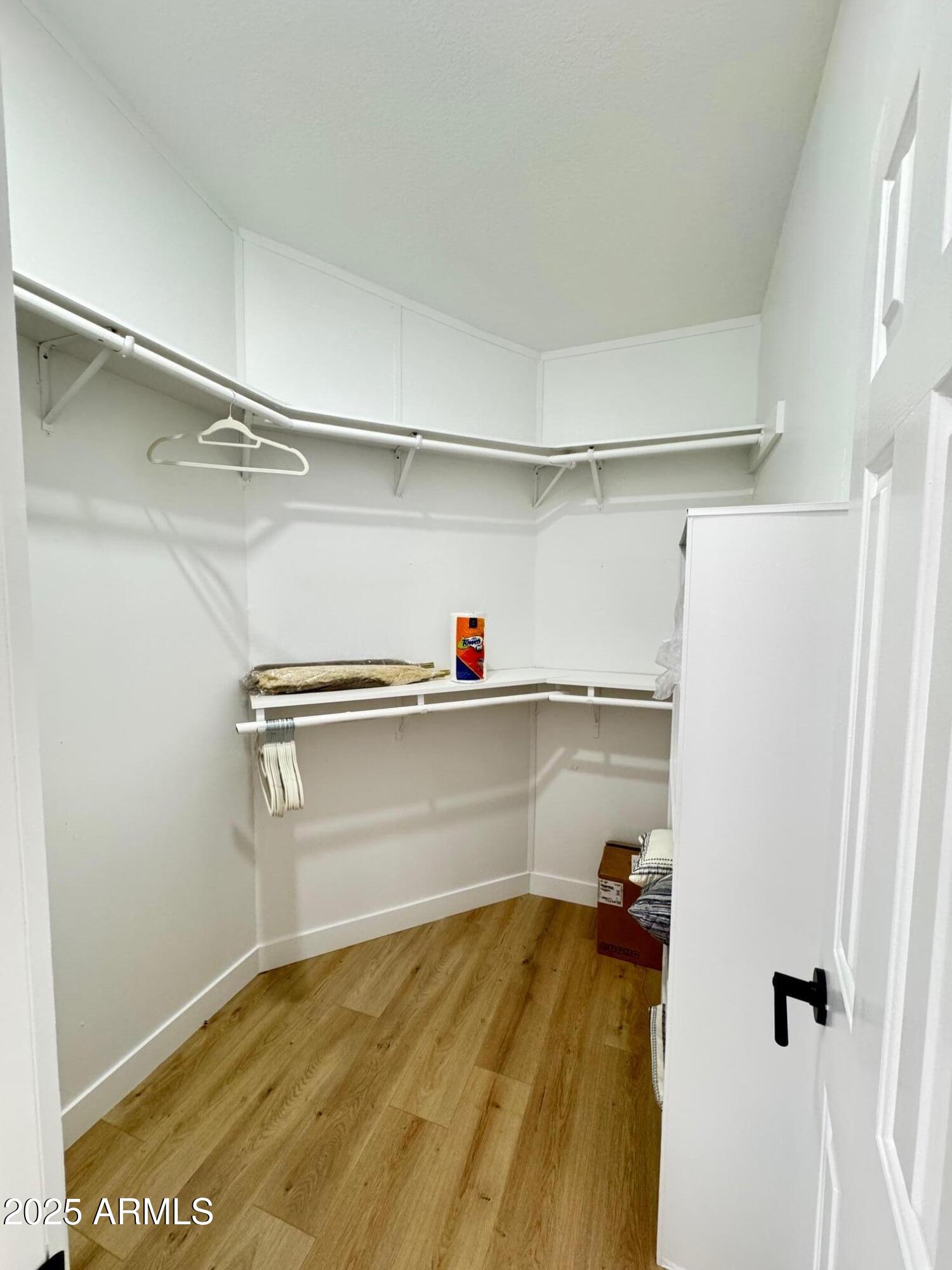 1835 East 20th Avenue Apache Junction, AZ 85119 - Photo 20 of 29 a view of walk in closet with clothes and shoes