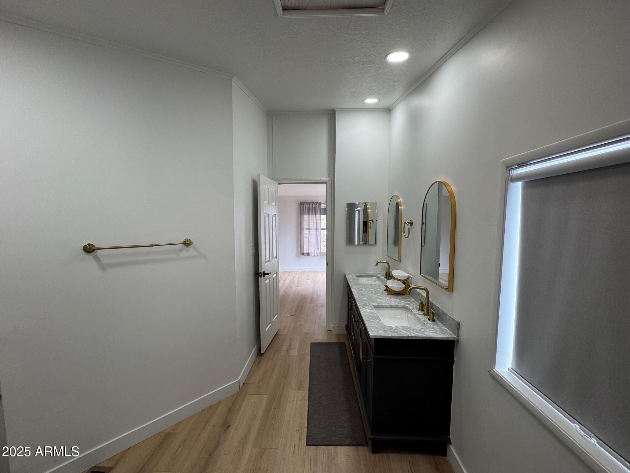 1835 East 20th Avenue Apache Junction, AZ 85119 - Photo 24 of 29 a bathroom with a sink and a mirror