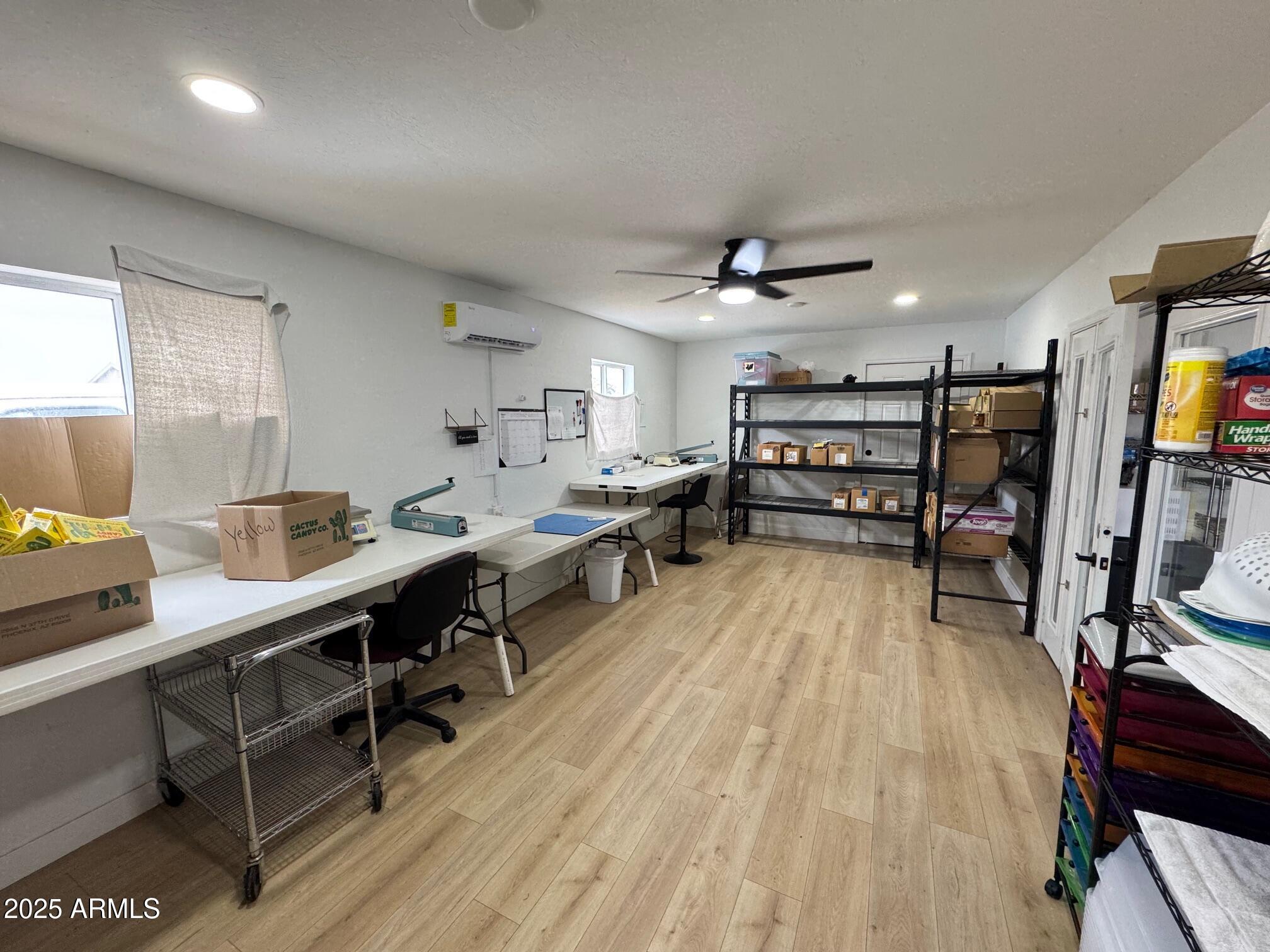 1835 East 20th Avenue Apache Junction, AZ 85119 - Photo 28 of 29 a large room with wooden floor and furniture