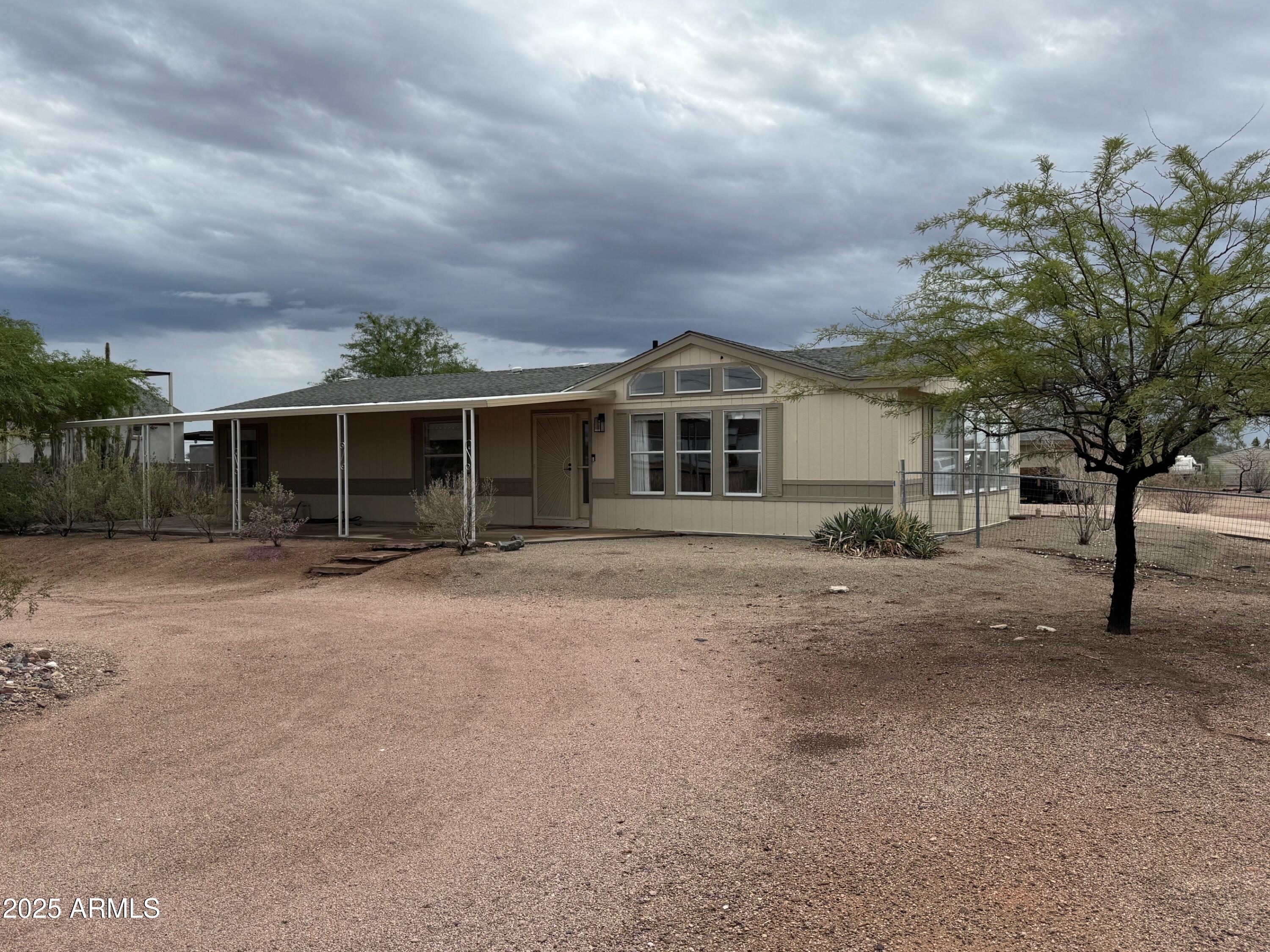 1835 East 20th Avenue Apache Junction, AZ 85119 - Photo 6 of 29 a view of a house with a backyard