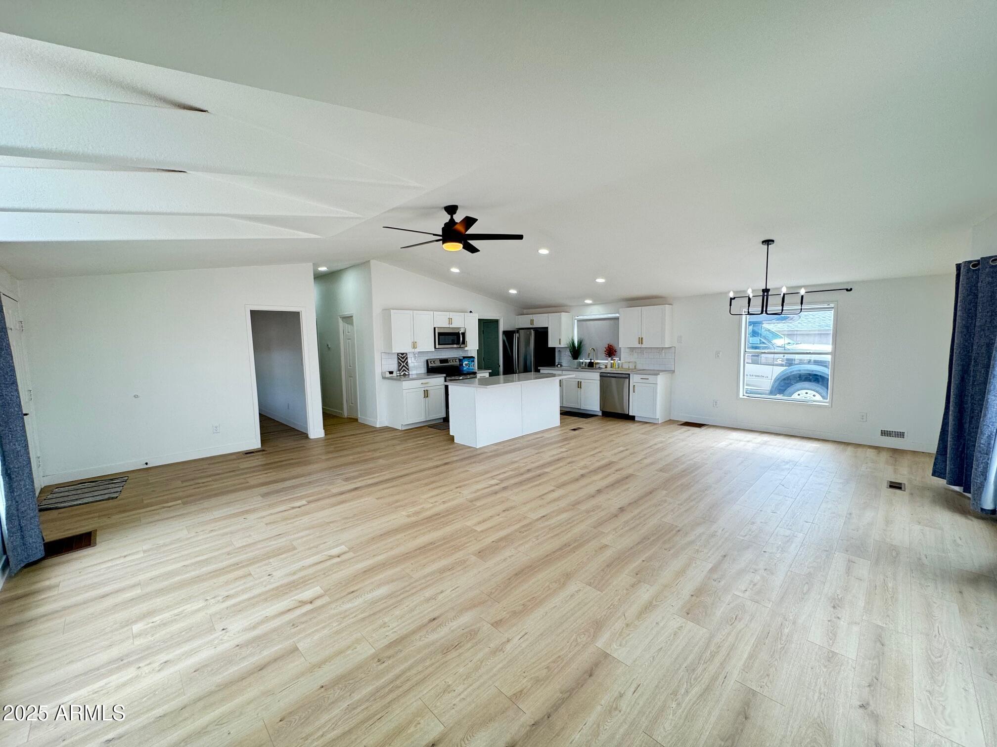 1835 East 20th Avenue Apache Junction, AZ 85119 - Photo 7 of 29 a view of a livingroom with furniture and a kitchen