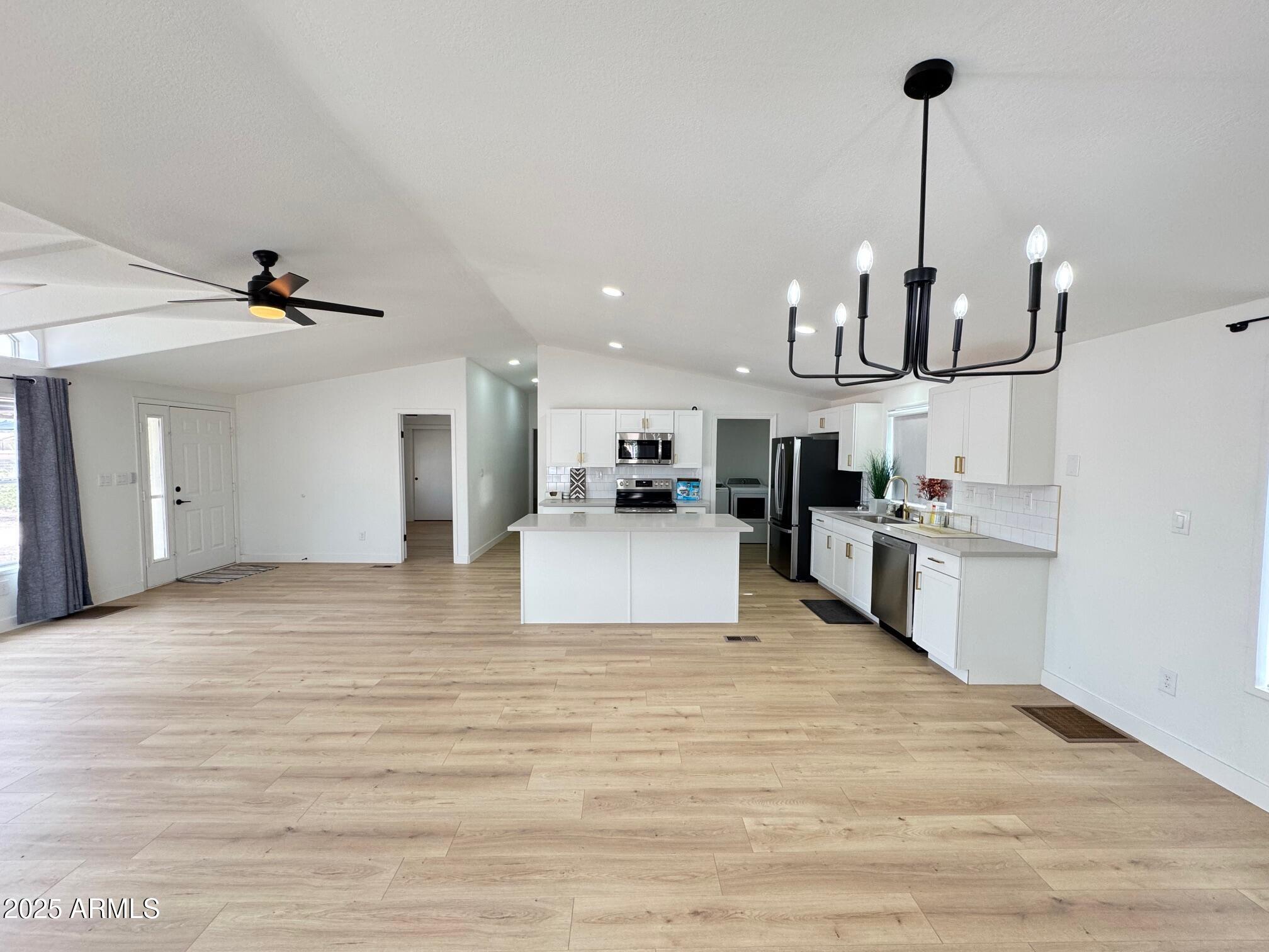1835 East 20th Avenue Apache Junction, AZ 85119 - Photo 8 of 29 a view of kitchen with refrigerator microwave and stove