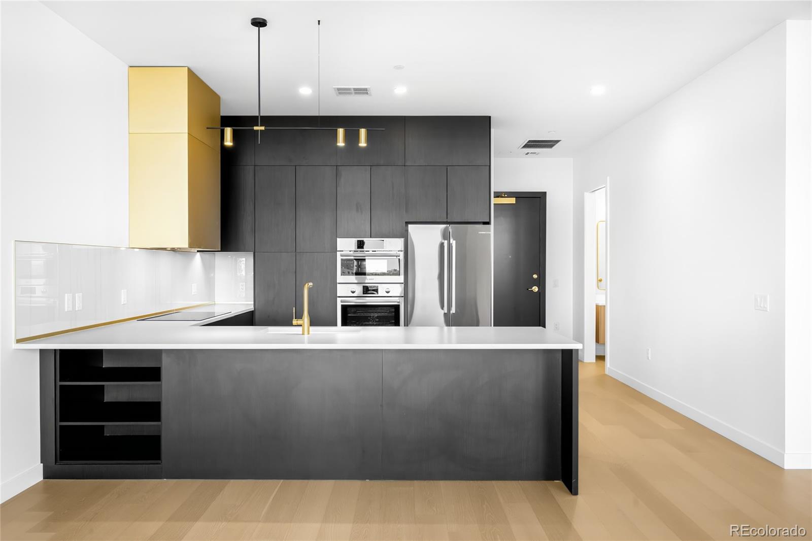 3520 Chestnut Place, Unit 1206 Denver, CO 80216 - Photo 1 of 41 a kitchen with stainless steel appliances a refrigerator and a stove