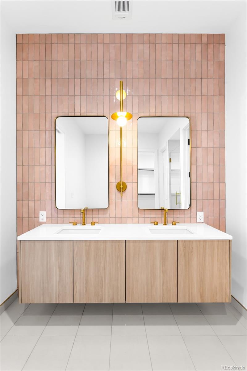 3520 Chestnut Place, Unit 1206 Denver, CO 80216 - Photo 18 of 41 a bathroom with a sink and a mirror