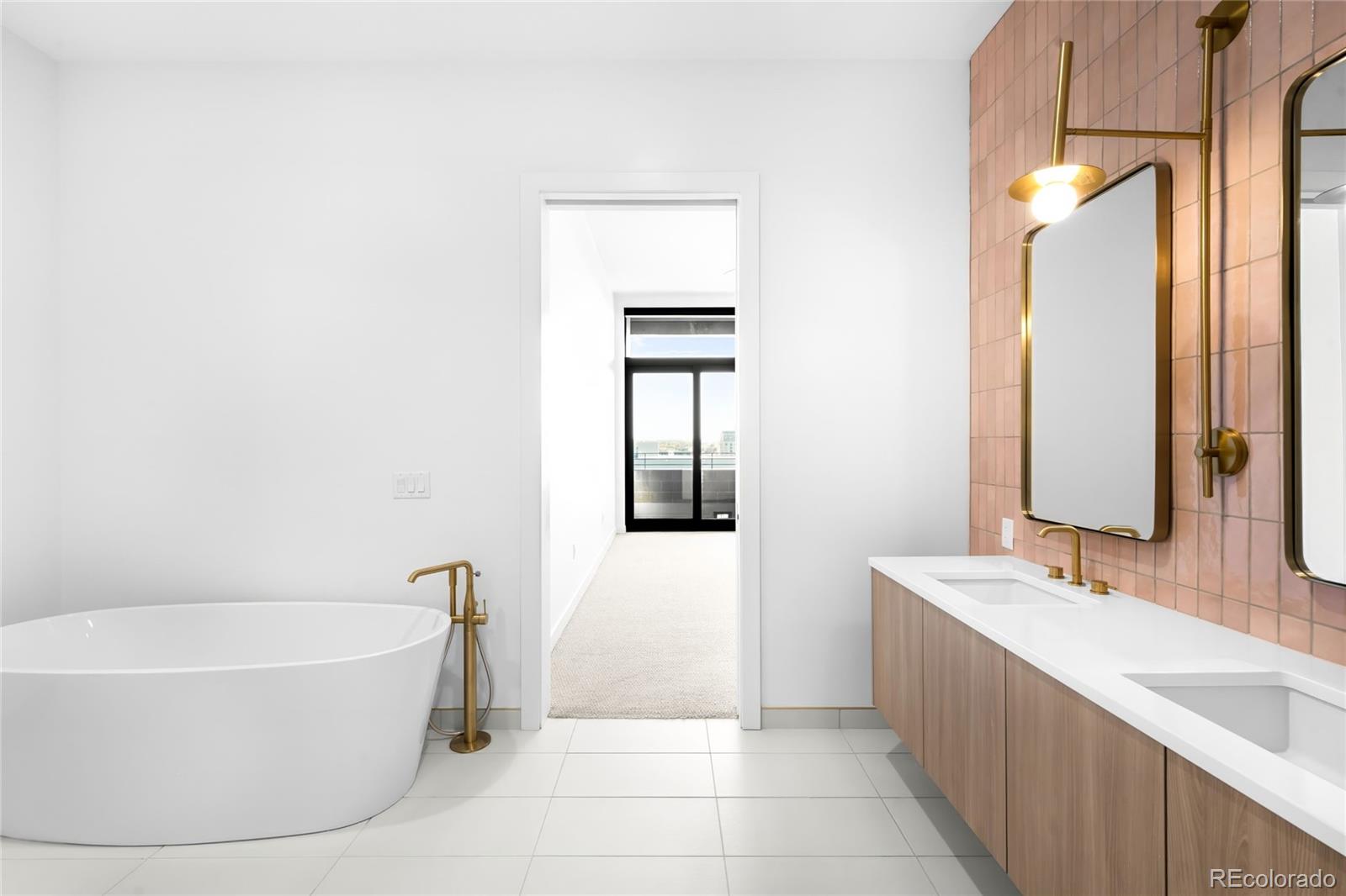 3520 Chestnut Place, Unit 1206 Denver, CO 80216 - Photo 19 of 41 a bathroom with a bathtub and a sink
