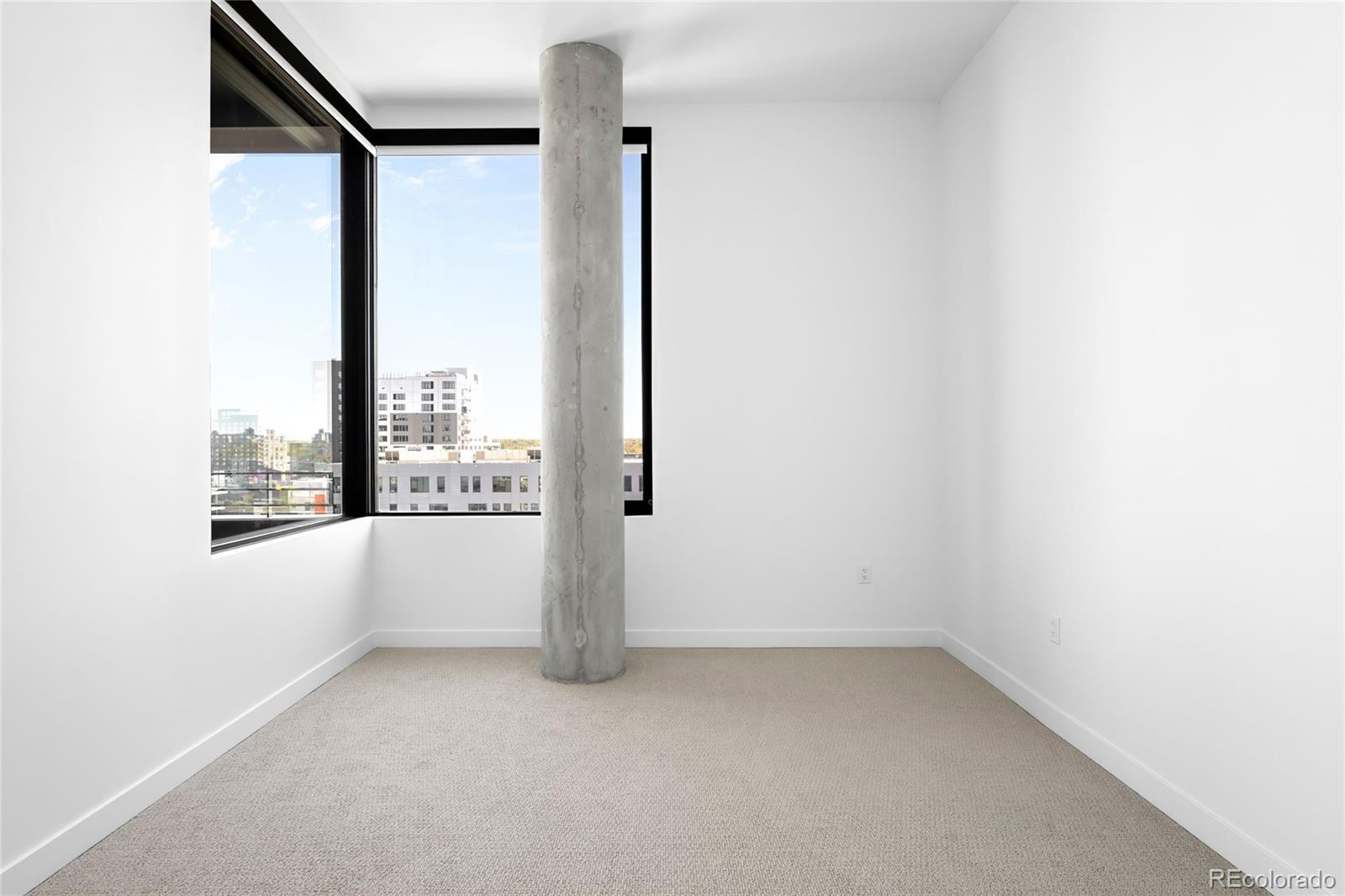 3520 Chestnut Place, Unit 1206 Denver, CO 80216 - Photo 24 of 41 a view of an empty room with a window