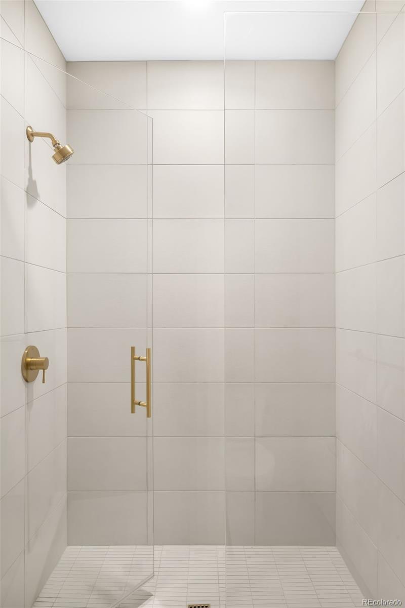 3520 Chestnut Place, Unit 1206 Denver, CO 80216 - Photo 27 of 41 a bathroom with a shower