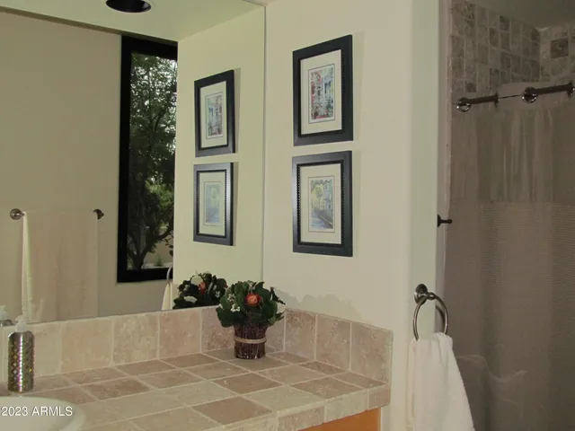 a bath room with a bathtub and shower