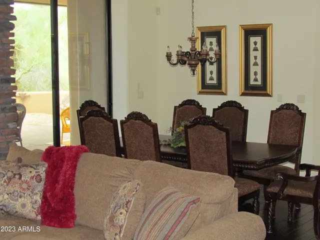 a bedroom with two beds and a chair