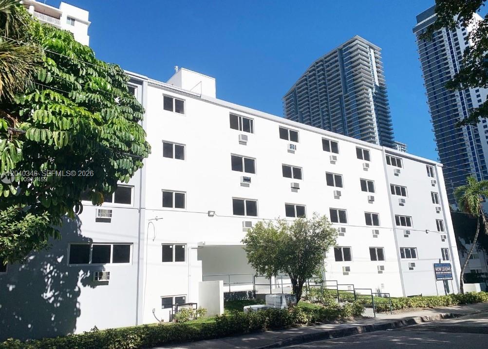 143 Southwest 9th Street, Unit 301 Miami, FL 33130 - Photo 11 of 16 a large building with a street