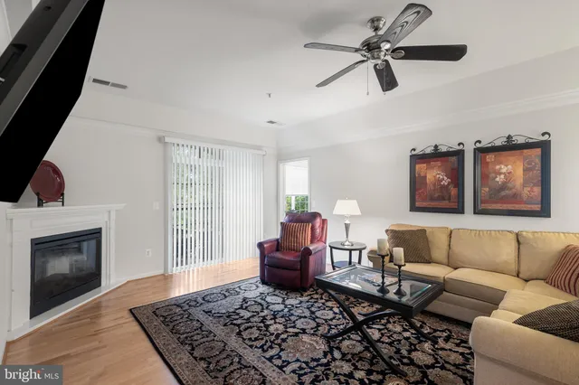 a living room with a couch and a fireplace
