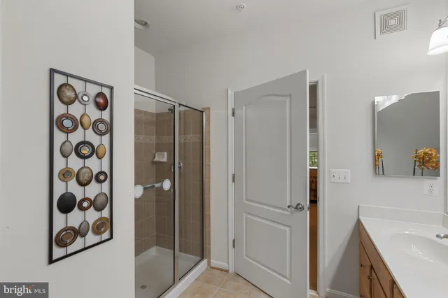 a bathroom with a shower and a sink