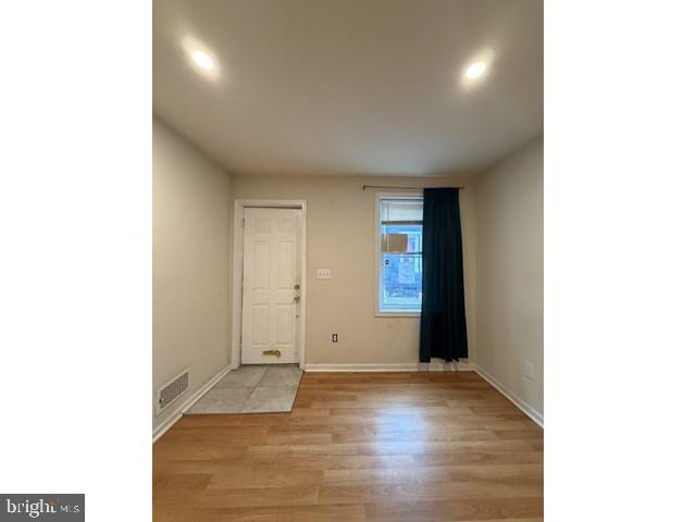 1609 Lemmon Street Baltimore, MD 21223 - Photo 3 of 16 a view of an empty room and window