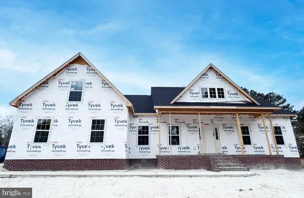 a view of a white building with large windows