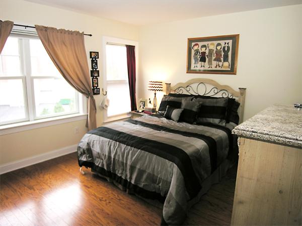 11 Cheriton Road, Unit 207B Boston, MA 02132 - Photo 8 of 10 a bedroom with a bed and a window