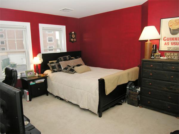 11 Cheriton Road, Unit 207B Boston, MA 02132 - Photo 9 of 10 a bedroom with a bed and a lamp