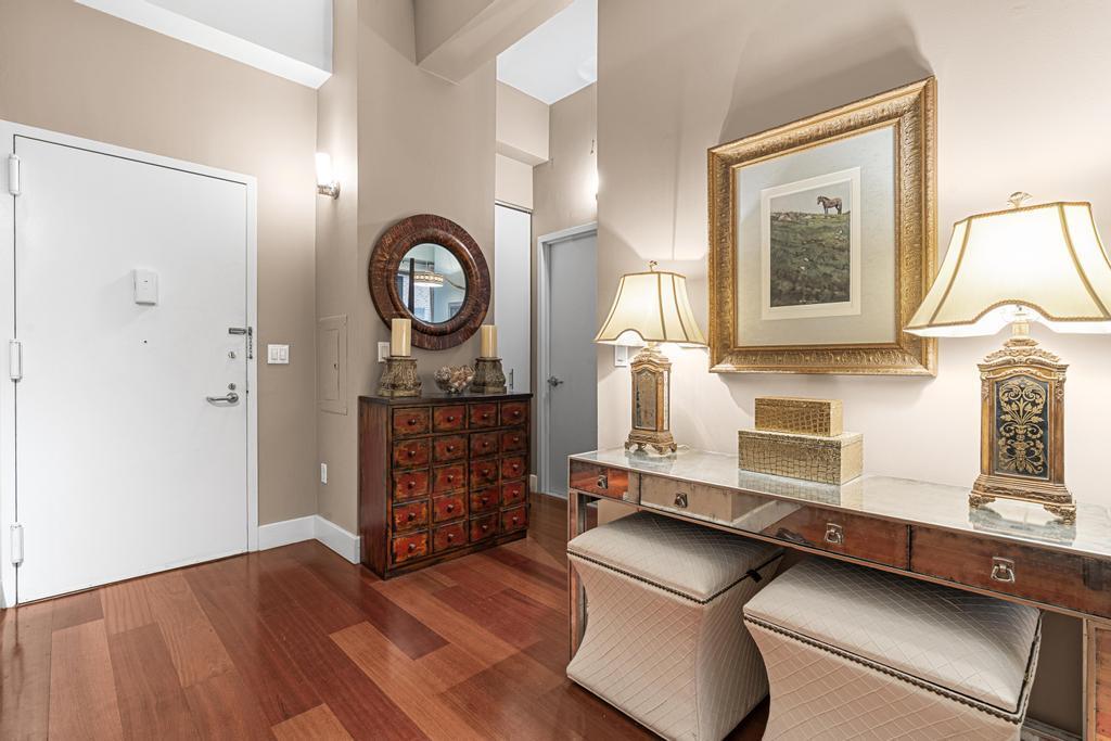 80 John Street, Unit 2A Manhattan, NY 10038 - Photo 5 of 10 a view of a livingroom with furniture and wooden floor
