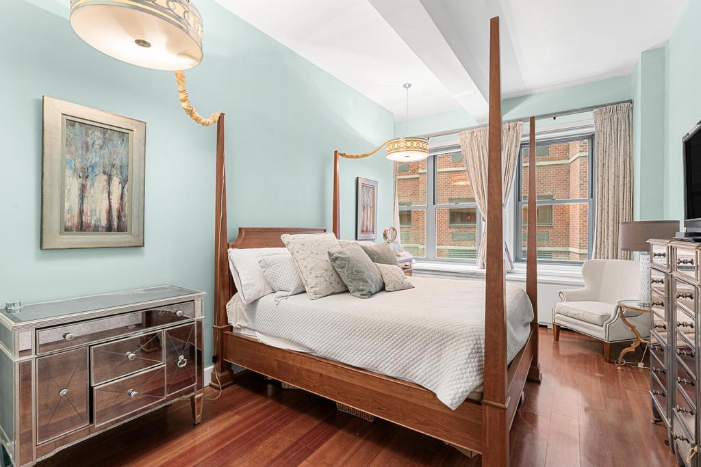 80 John Street, Unit 2A Manhattan, NY 10038 - Photo 7 of 10 a bedroom with a bed and wooden floor