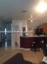 a kitchen with a sink stainless steel appliances and cabinets