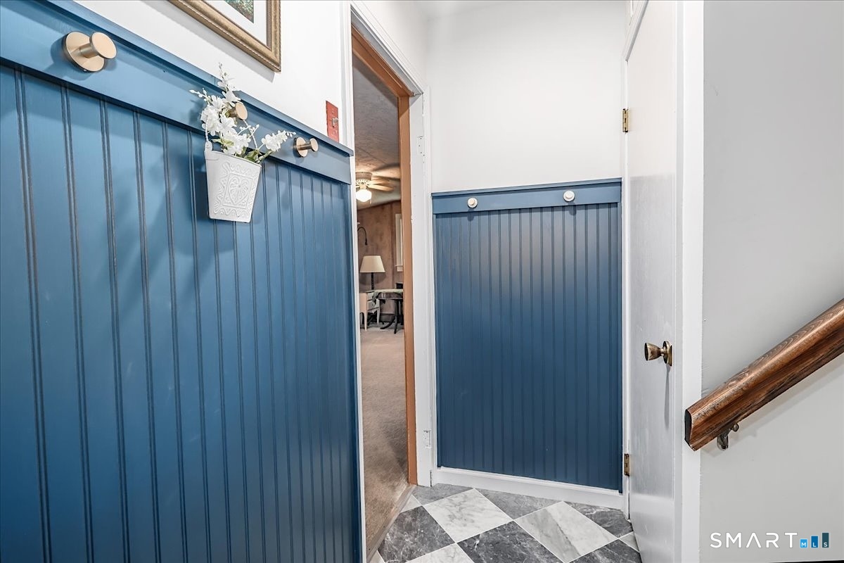 23 Cedar Hill Road Newtown, CT 06470 - Photo 26 of 30 Lower Garage Entry with New Custom Garage Entry Door, Custom Beadboard and Convenient Hooks for Coats