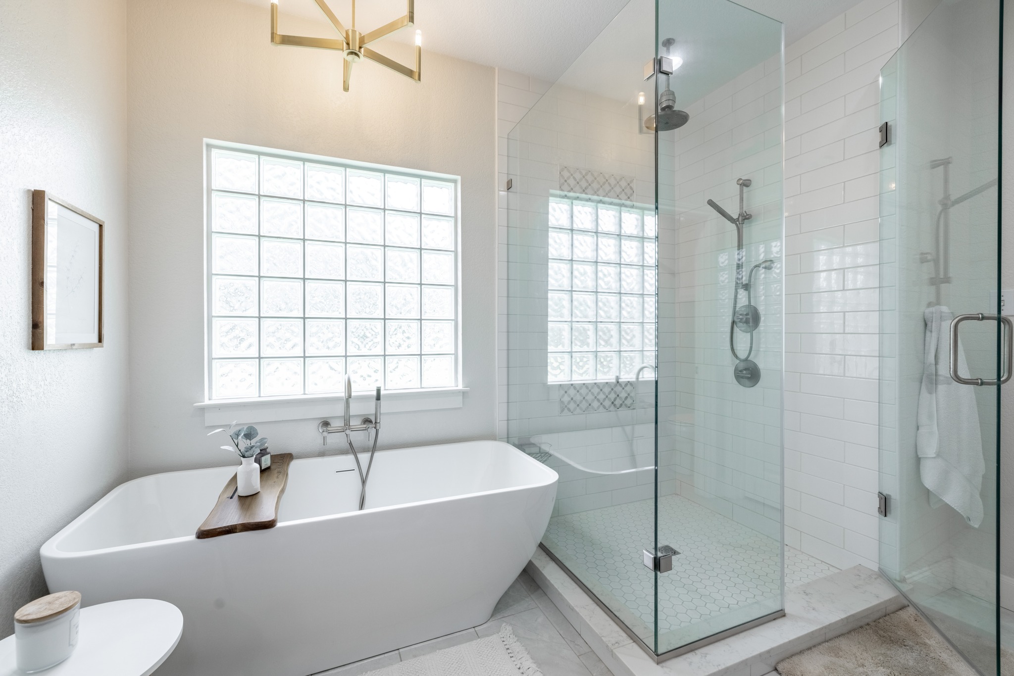 108 Kyle Lane Georgetown, TX 78633 - Photo 12 of 26 Freestanding soaking tub alongside a walk-in shower with clear glass enclosure
