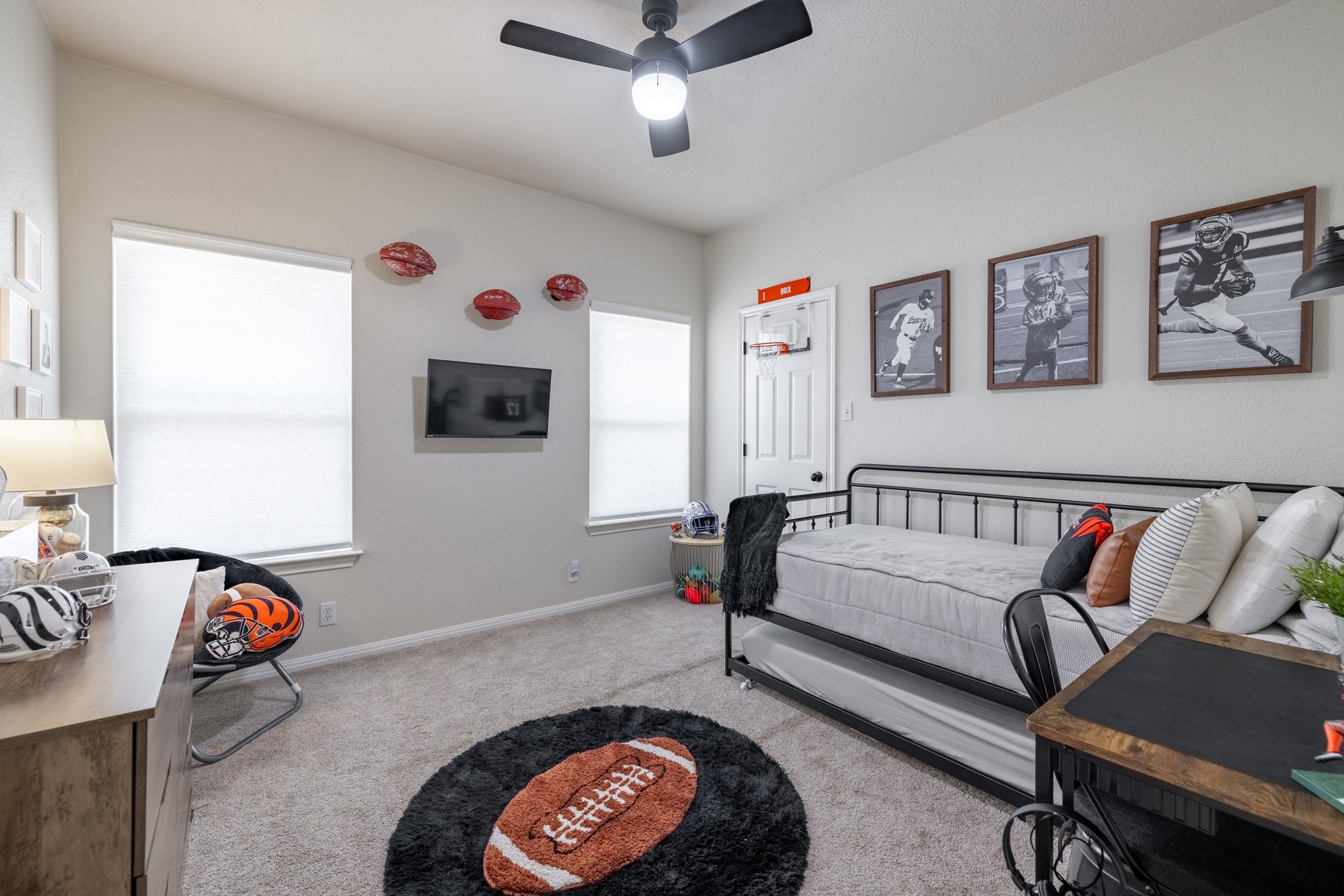 108 Kyle Lane Georgetown, TX 78633 - Photo 14 of 26 Carpeted room featuring multiple windows with blinds, a ceiling fan with integrated lighting, and a solid door