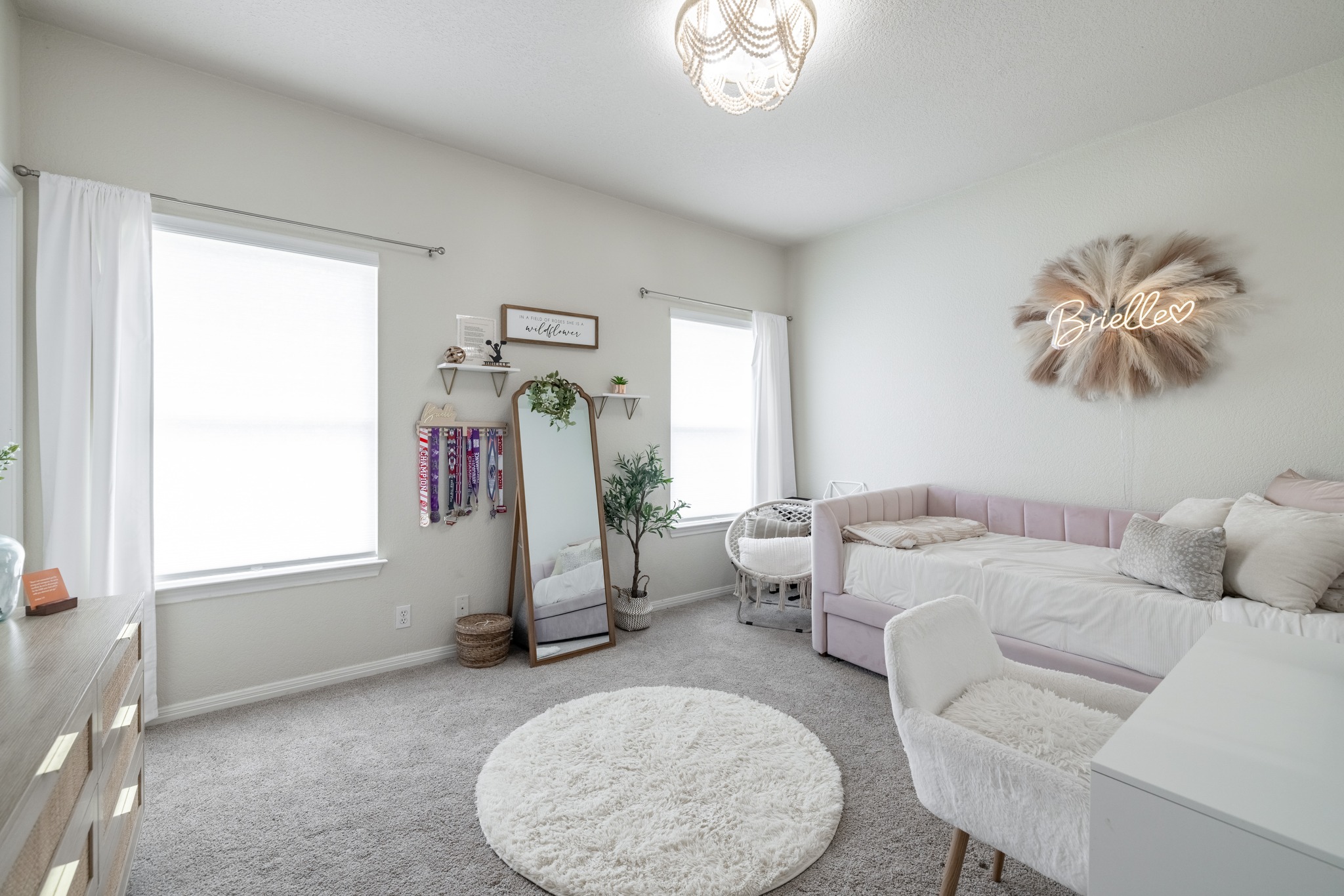 108 Kyle Lane Georgetown, TX 78633 - Photo 15 of 26 Spacious room featuring light gray carpet flooring, white walls, and two large windows with roller shades and curtain rods