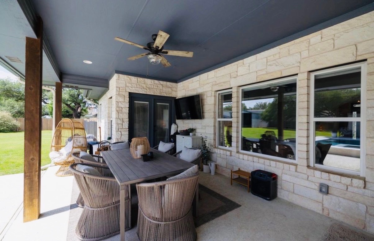 108 Kyle Lane Georgetown, TX 78633 - Photo 22 of 26 Covered outdoor patio featuring a ceiling fan, recessed lighting, and a stone facade