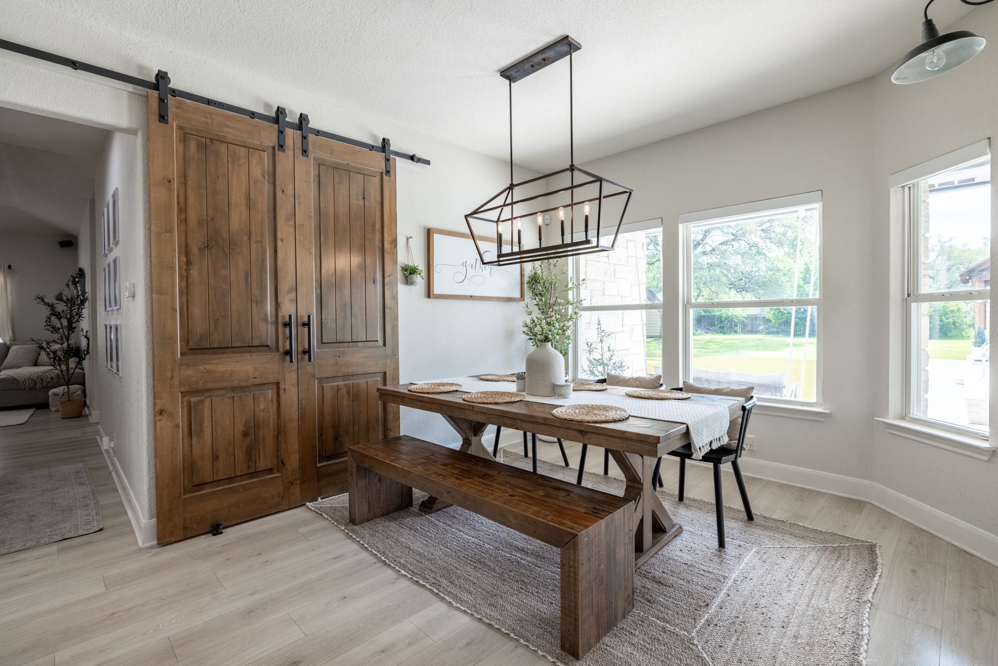 108 Kyle Lane Georgetown, TX 78633 - Photo 7 of 26 Dining area featuring light wood-finish flooring and a contemporary linear chandelier