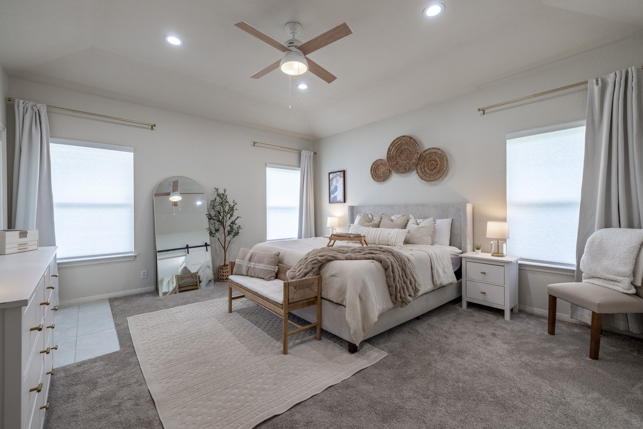 108 Kyle Lane Georgetown, TX 78633 - Photo 10 of 26 Spacious room featuring vaulted ceilings, recessed lighting, a ceiling fan with light, multiple windows with blinds, and plush carpet flooring