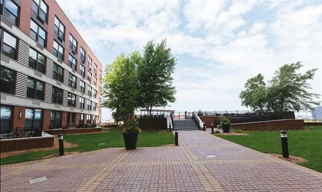 a view of a street with a building in the background